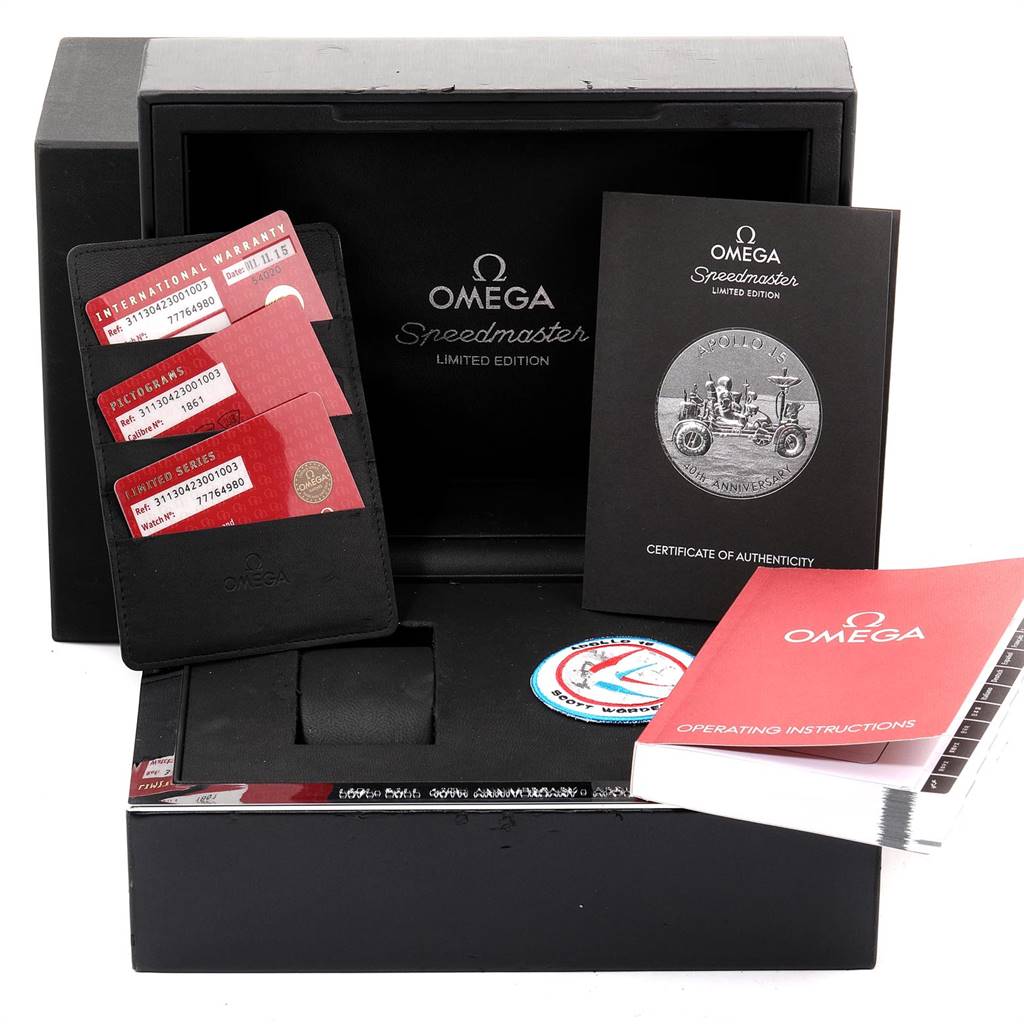 This image shows the packaging, warranty cards, and booklets for the Omega Speedmaster 311.30.42.30.01.003 Men
s Stainless Steel Black Dial 311.30.42.30.01.003 Men
s Stainless Steel Black Dial Limited Edition watch.