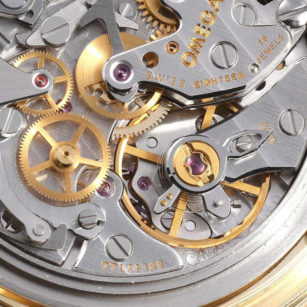 This close-up image shows the intricate inner workings and gears of the Omega Speedmaster 3695.50.31 Men's Yellow Gold Black Dial 3695.50.31 Men's Yellow Gold Black Dial watch movement.