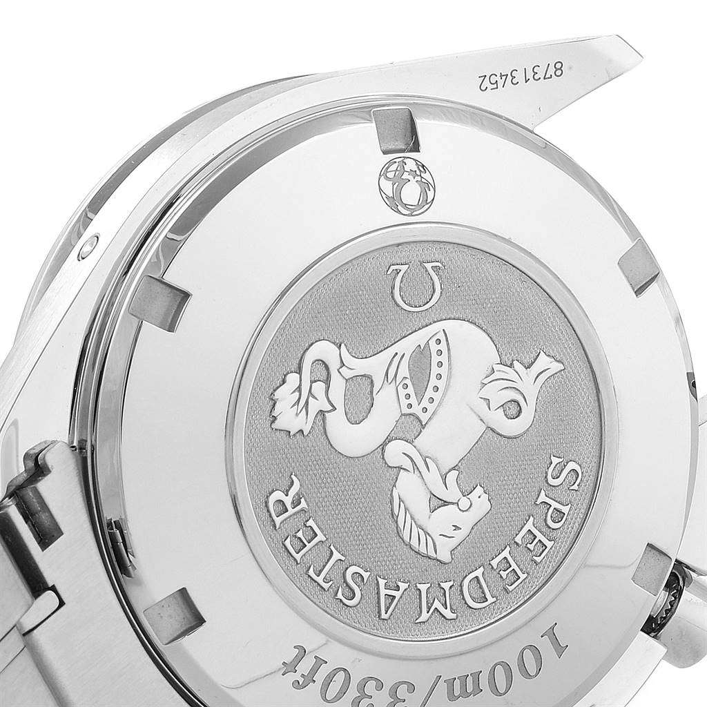 The image shows the case back of the Omega Speedmaster 323.30.40.40.06.001 Men
s Stainless Steel Grey Dial 323.30.40.40.06.001 Men
s Stainless Steel Grey Dial watch, featuring its details and engravings.