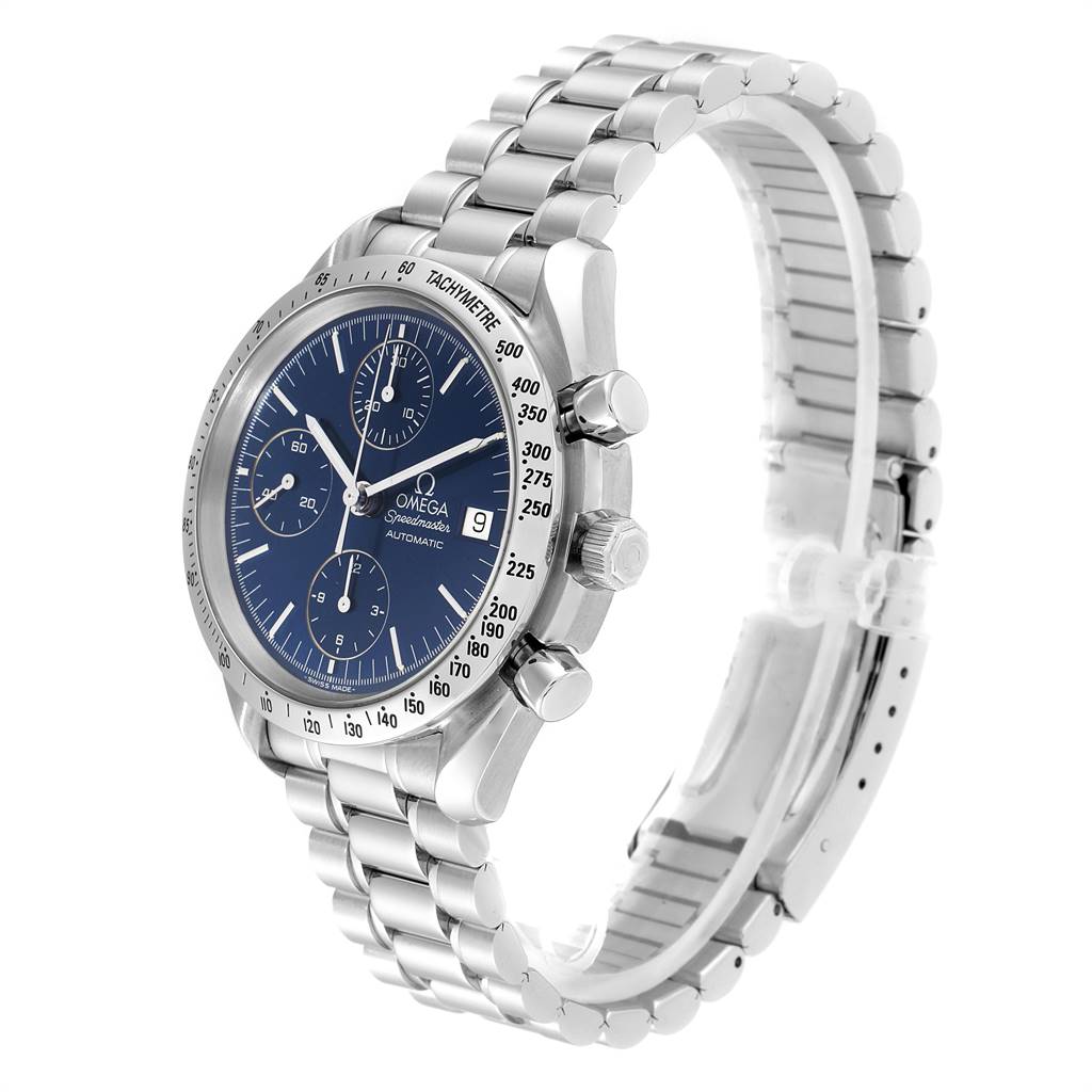 The image shows an angled side view of an Omega Speedmaster 3511.80.00 Men
s Stainless Steel Blue Dial 3511.80.00 Men
s Stainless Steel Blue Dial watch, highlighting its blue dial, three subdials, tachymeter, and metal bracelet.