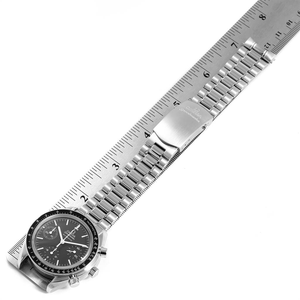 The image shows an Omega Speedmaster 3539.50.00 Men
s Stainless Steel Black Dial 3539.50.00 Men
s Stainless Steel Black Dial watch laid flat against a ruler, displaying the face, bracelet, and clasp.