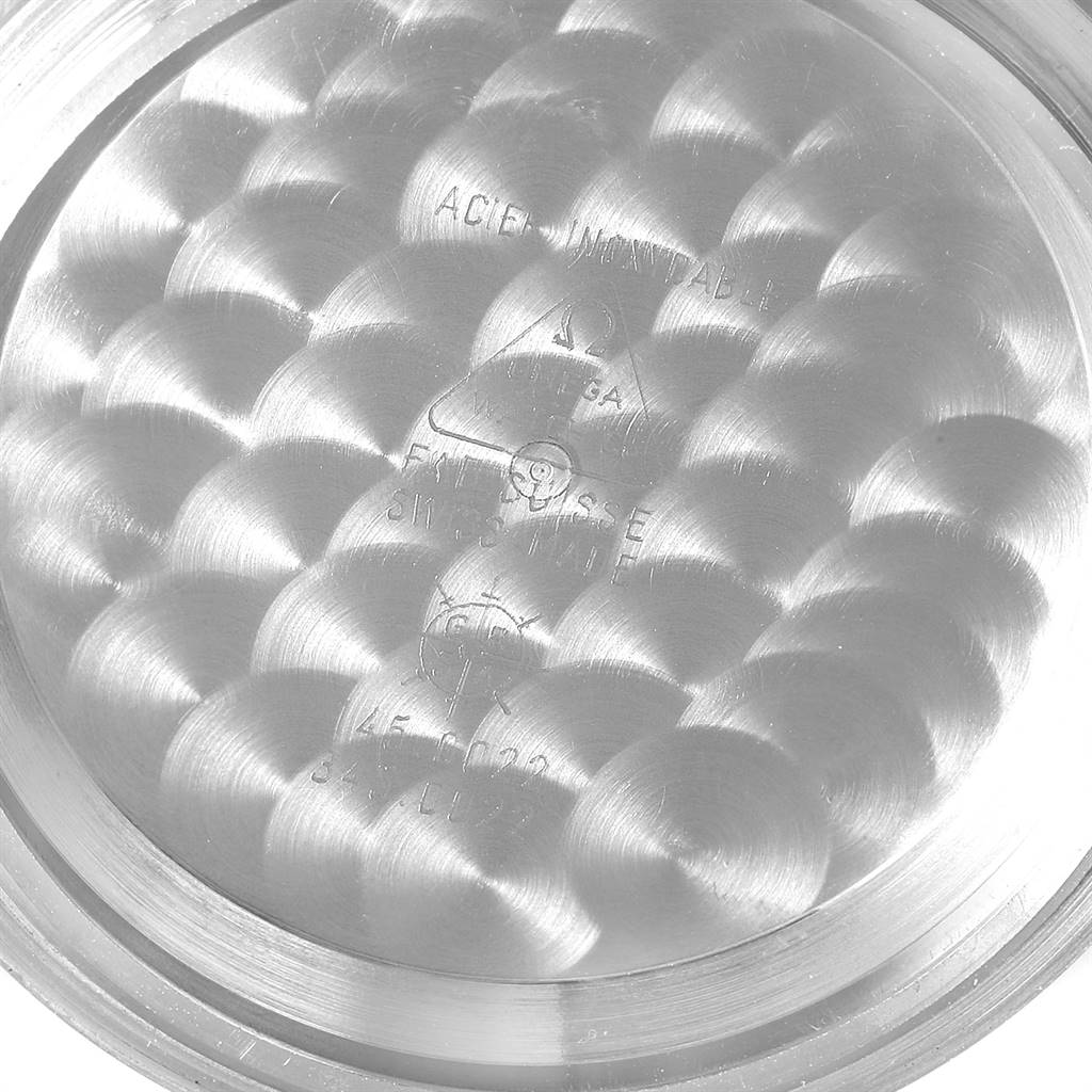 The image shows the inner case back of an Omega Speedmaster 145.022 Men's Stainless Steel Black Dial 145.022 Men's Stainless Steel Black Dial watch, featuring intricate engravings and circular patterns.