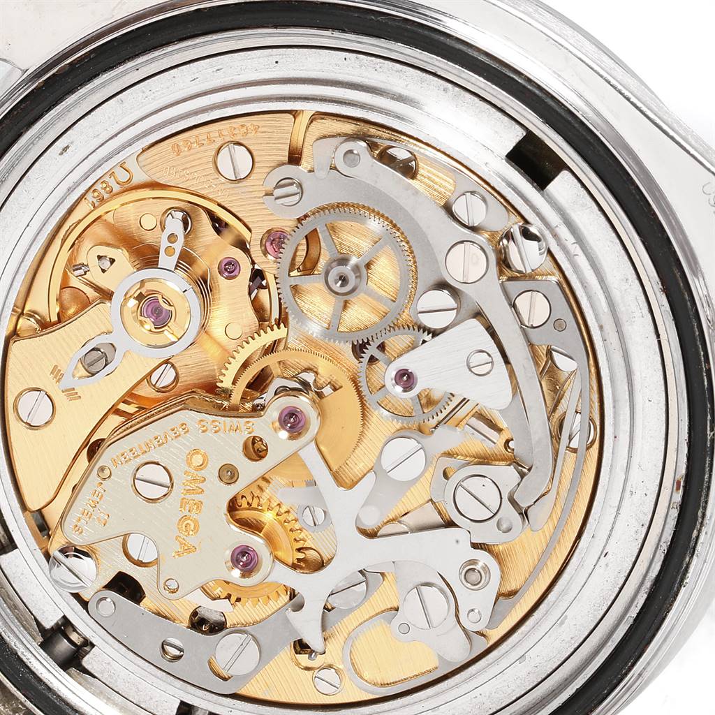 The image shows the intricate movement and inner mechanisms of an Omega Speedmaster Men's Stainless Steel Black Dial Men's Stainless Steel Black Dial watch from a close-up angle.