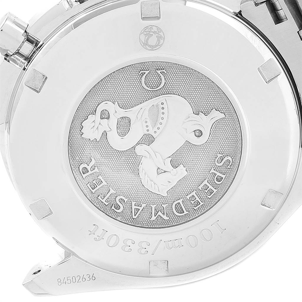 This image shows the back case of the Omega Speedmaster 3220.50.00 Men
s Stainless Steel Black Dial 3220.50.00 Men
s Stainless Steel Black Dial watch, displaying its medallion and surrounding details.