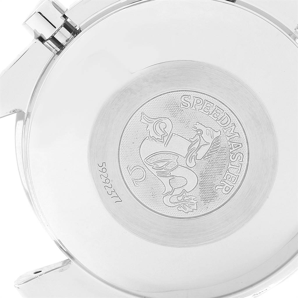 The image shows the case back of an Omega Speedmaster 3513.54.00 Men's Stainless Steel Black Dial 3513.54.00 Men's Stainless Steel Black Dial watch, featuring an engraved emblem and some serial numbers.