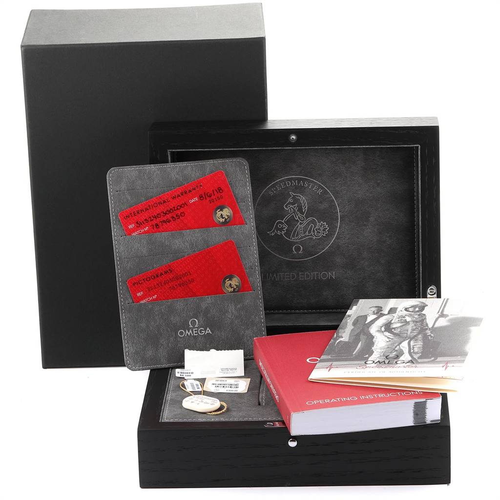 The image shows a black Omega Speedmaster 311.32.40.30.02.001 Men's Stainless Steel Silver Dial 311.32.40.30.02.001 Men's Stainless Steel Silver Dial watch box with warranty cards, manuals, and accessories.