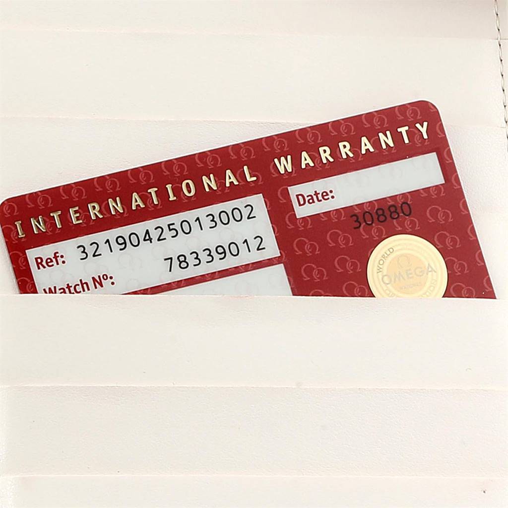 This image shows the international warranty card for the Omega Speedmaster 321.90.42.50.13.002 Men's Steel and Gold (two tone) Brown Dial 321.90.42.50.13.002 Men's Steel and Gold (two tone) Brown Dial watch model, displayed partially inside a pocket.