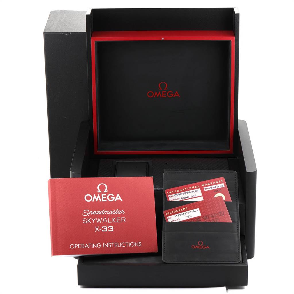 The image shows the packaging contents for the Omega Speedmaster 318.90.45.79.01.001 Men's Titanium Black Dial 318.90.45.79.01.001 Men's Titanium Black Dial Skywalker X-33, including the box, warranty cards, and manual.