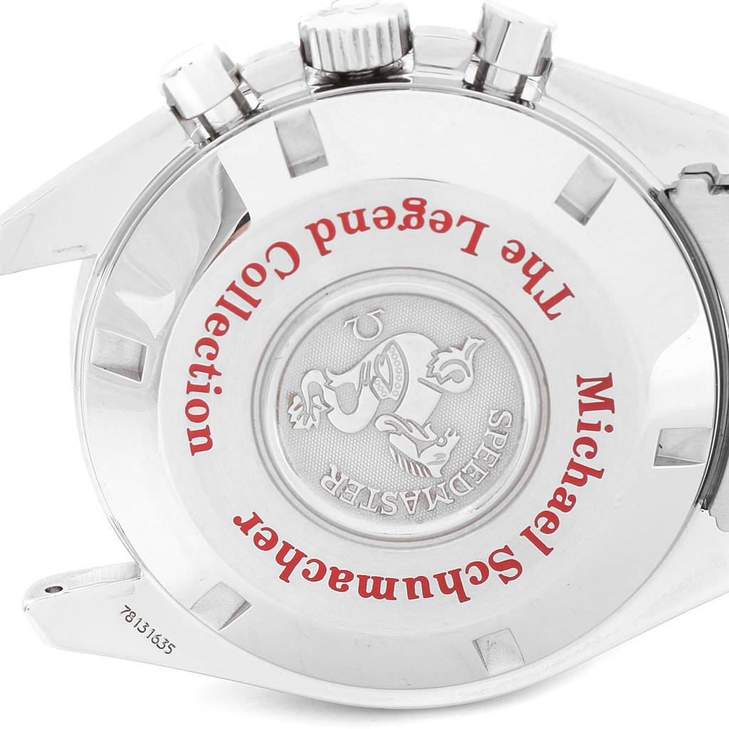The image shows the case back of an Omega Speedmaster 3506.31.00 Men
s Stainless Steel Silver Dial 3506.31.00 Men
s Stainless Steel Silver Dial Michael Schumacher The Legend Collection watch from a close-up angle.