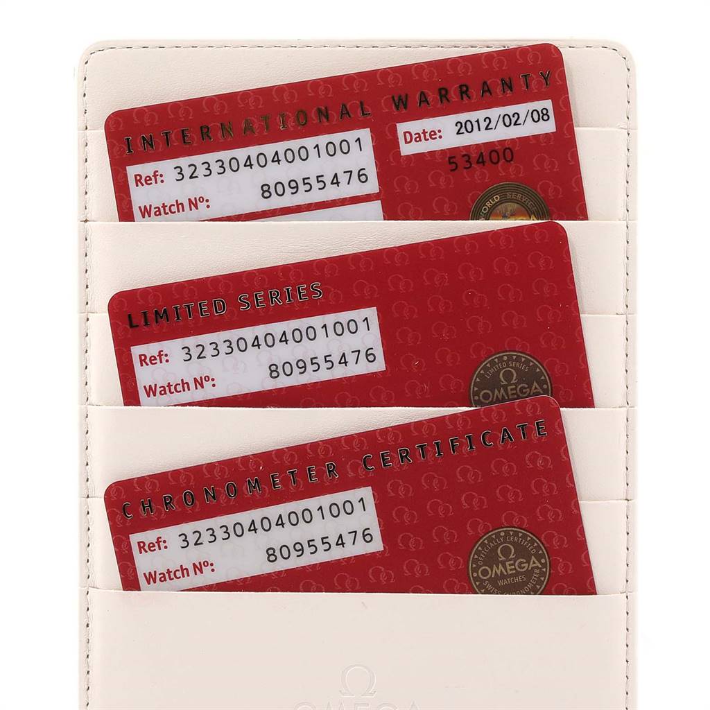 The image shows three red certification cards for an Omega Speedmaster 323.30.40.40.01.001 Men
s Stainless Steel Black Dial 323.30.40.40.01.001 Men
s Stainless Steel Black Dial watch, stored in a white cardholder.