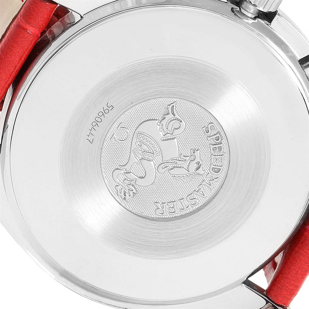 The image shows the back case of an Omega Speedmaster 3834.79.40 Women's Stainless Steel Mother of Pearl Dial 3834.79.40 Women's Stainless Steel Mother of Pearl Dial watch, displaying the engraved logo and serial number, along with a red strap.