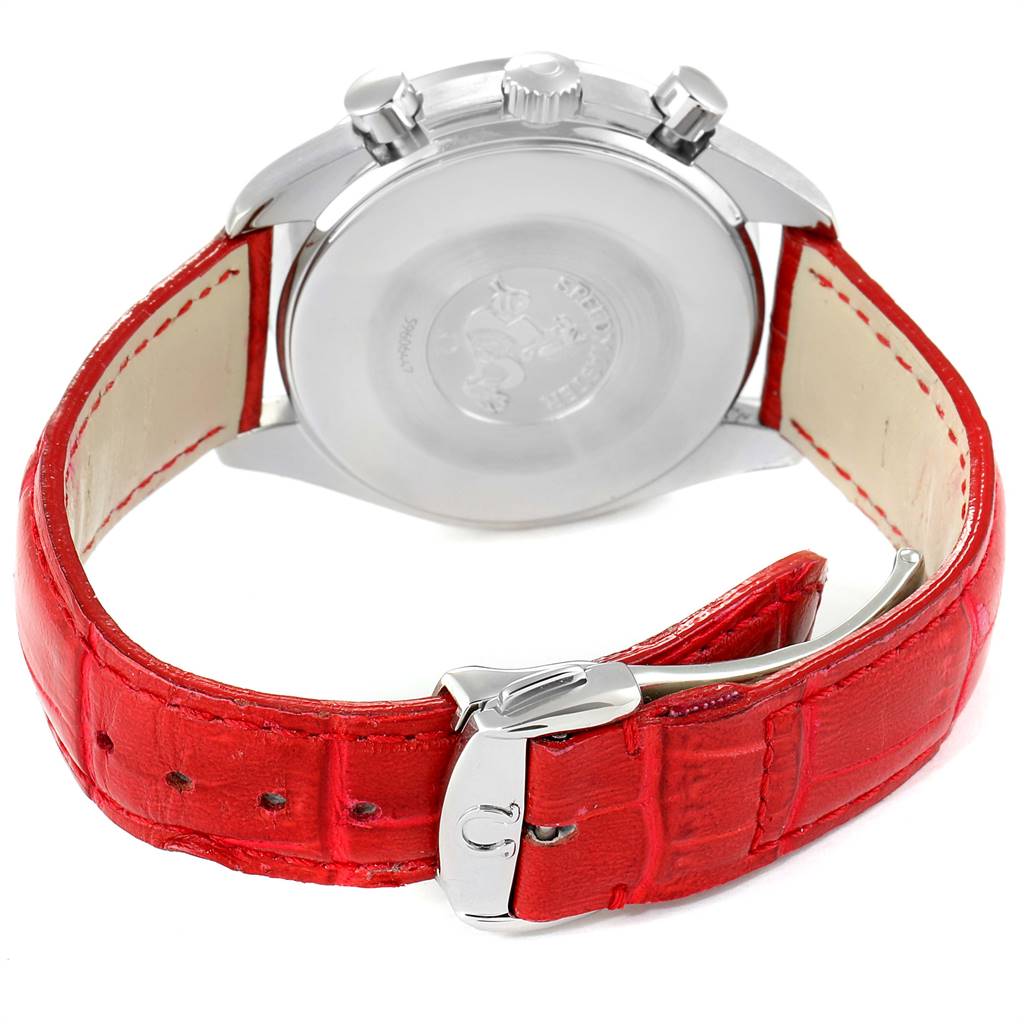 The image shows the back case, crown, pushers, and red strap with buckle of the Omega Speedmaster 3834.79.40 Women's Stainless Steel Mother of Pearl Dial 3834.79.40 Women's Stainless Steel Mother of Pearl Dial watch.