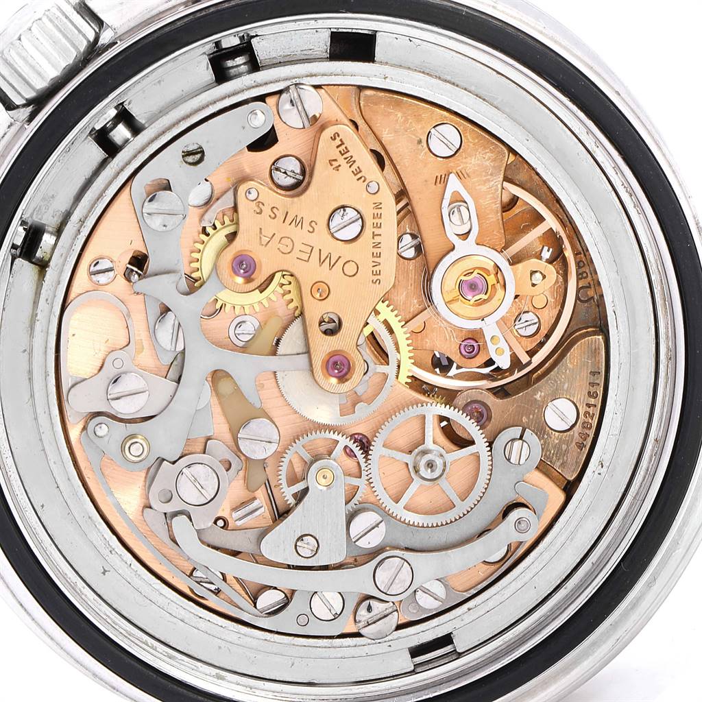 The image shows a close-up of the Omega Speedmaster 3570.50.00 Men
s Stainless Steel Black Dial 3570.50.00 Men
s Stainless Steel Black Dial
s internal mechanical movement, highlighting gears and mechanisms.