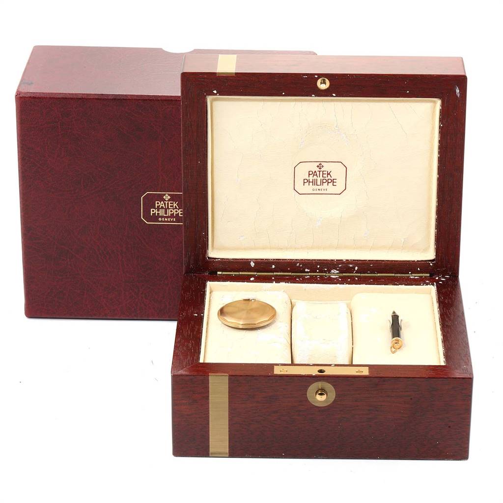 This image shows the box of a Patek Philippe 3970 Men's Yellow Gold Silver Dial 3970 Men's Yellow Gold Silver Dial Perpetual Calendar Chronograph Yellow Gold Men's Watch 3970, displaying an empty watch slot and accessories.