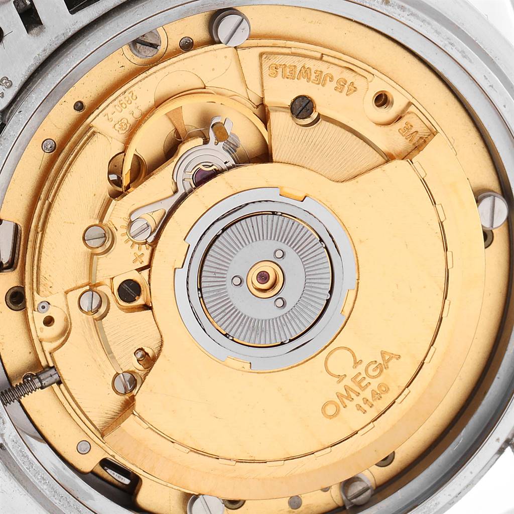 The image shows a close-up view of the movement components of an Omega Speedmaster 3510.50.00 Men
s Stainless Steel Black Dial 3510.50.00 Men
s Stainless Steel Black Dial watch, highlighting its intricate internal mechanism.
