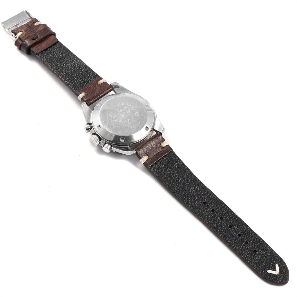 The image shows the back view of an Omega Speedmaster 145.012 Men's Stainless Steel Black Dial 145.012 Men's Stainless Steel Black Dial watch, highlighting its case back and leather strap.