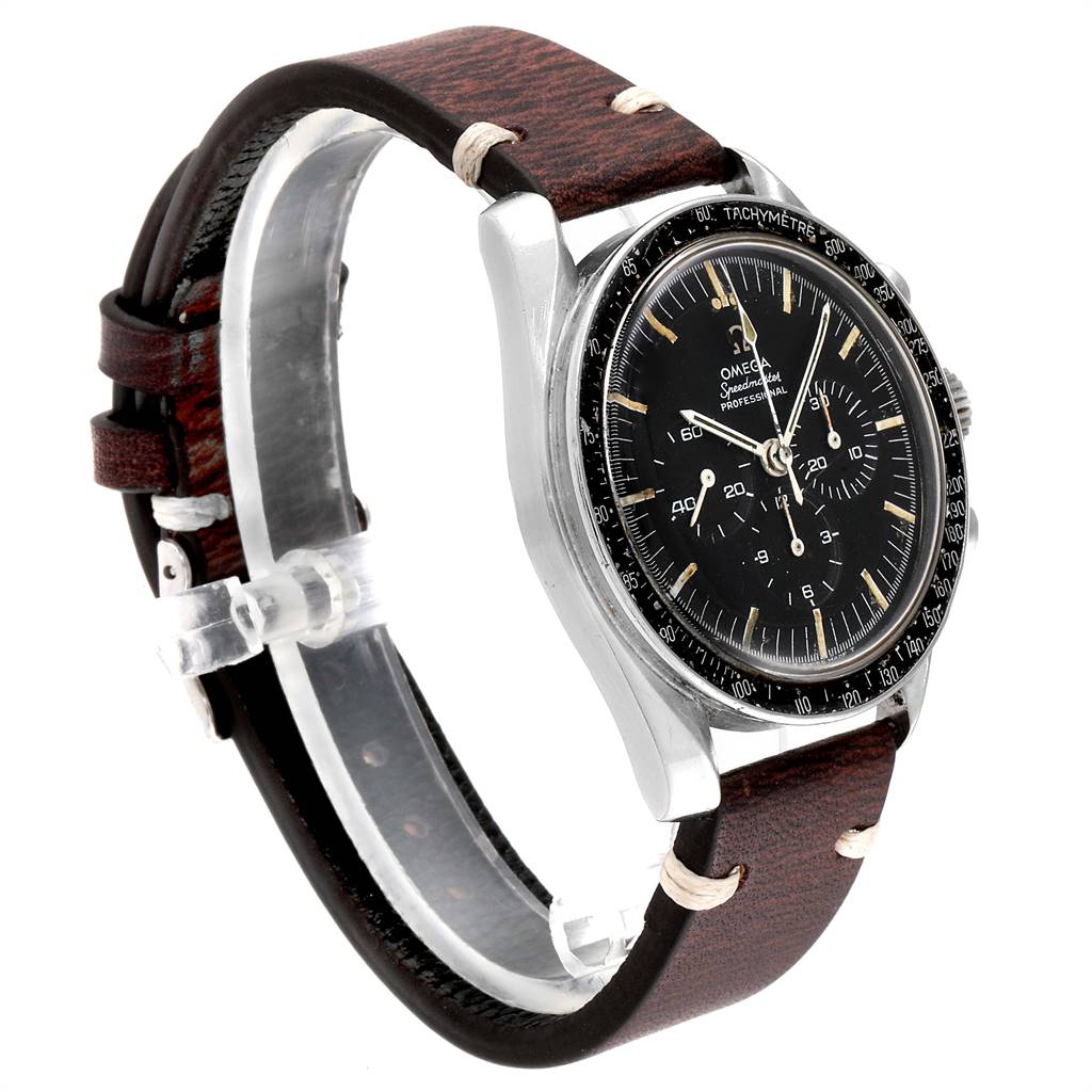 The image shows an Omega Speedmaster 145.012 Men's Stainless Steel Black Dial 145.012 Men's Stainless Steel Black Dial watch from a side view, highlighting the bezel, dial, and leather strap.