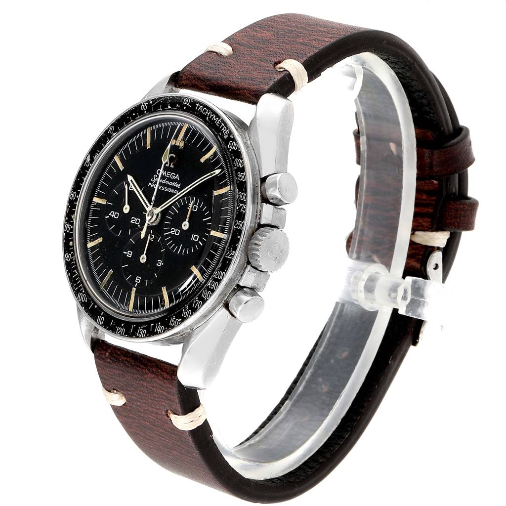 This image shows an Omega Speedmaster 145.012 Men's Stainless Steel Black Dial 145.012 Men's Stainless Steel Black Dial watch at an angle highlighting its face, buttons, and brown leather strap.