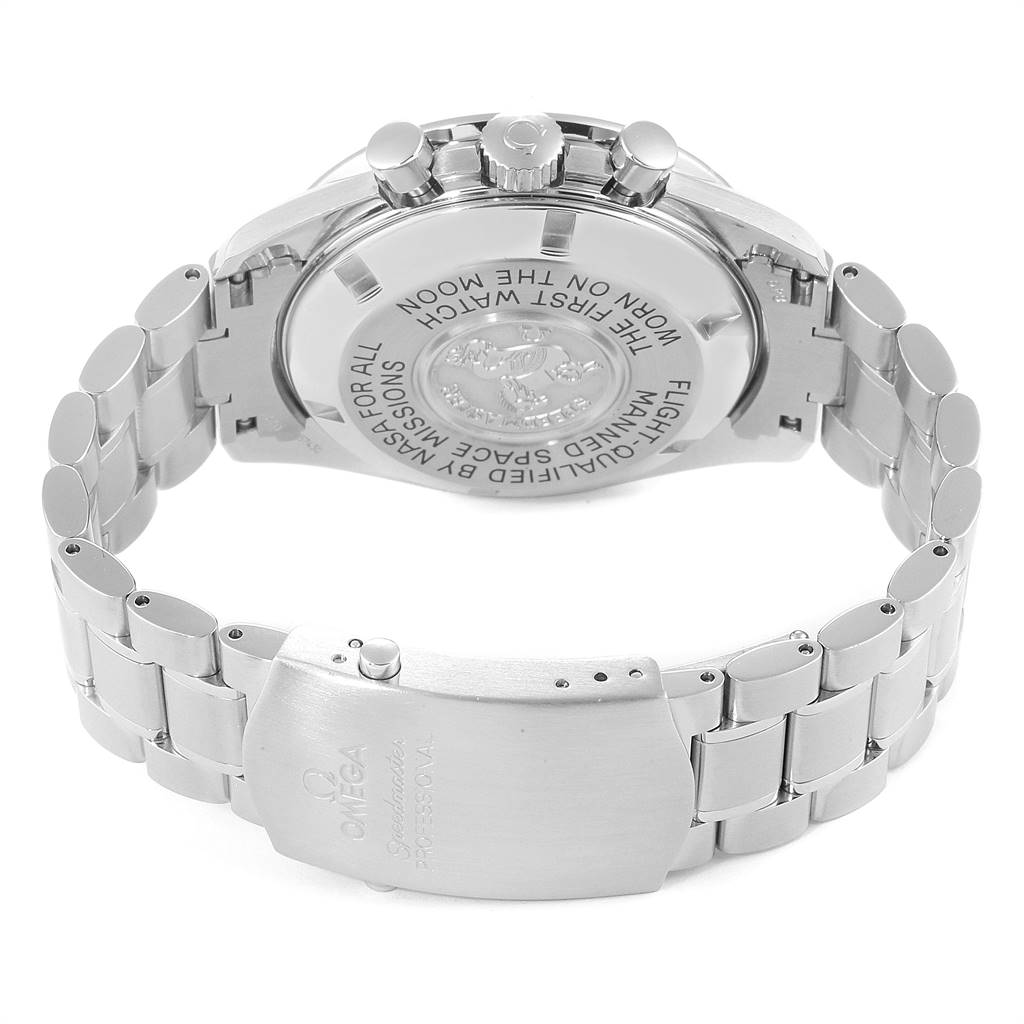 The image shows the back view and clasp of an Omega Speedmaster 3570.50.00 Men
s Stainless Steel Black Dial 3570.50.00 Men
s Stainless Steel Black Dial watch, highlighting its inscriptions and metal bracelet.