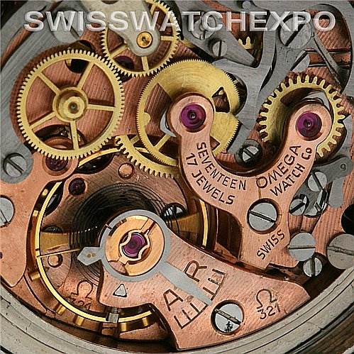 This close-up image shows the intricate internal mechanism of the Omega Speedmaster Men's Stainless Steel Black Dial Men's Stainless Steel Black Dial watch, highlighting its gears and jewels.