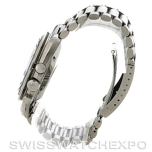 This image shows a side view of the Omega Speedmaster Men
s Stainless Steel Black Dial Men
s Stainless Steel Black Dial watch, highlighting the crown, pushers, and stainless steel bracelet.