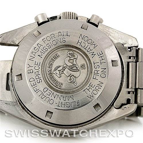 The image shows the back case of an Omega Speedmaster Men
s Stainless Steel Black Dial Men
s Stainless Steel Black Dial watch, highlighting engravings and the steel bracelet clasp.