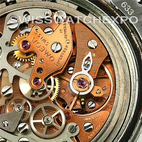 This image shows a close-up view of the inner mechanical workings of an Omega Speedmaster Men
s Stainless Steel Black Dial Men
s Stainless Steel Black Dial watch, focusing on the gears and movement components.