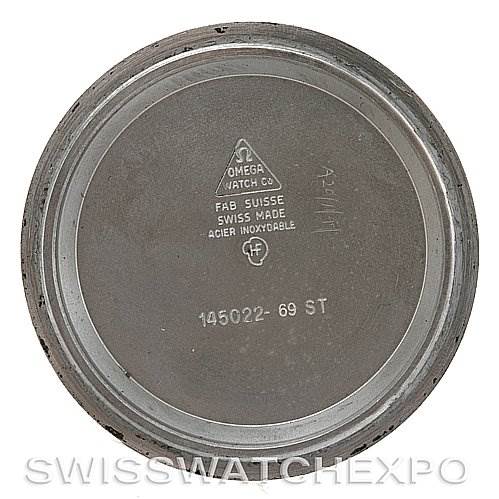 This image shows the inside of the case back for an Omega Speedmaster Men's Stainless Steel Black Dial Men's Stainless Steel Black Dial watch, displaying engravings and model information.