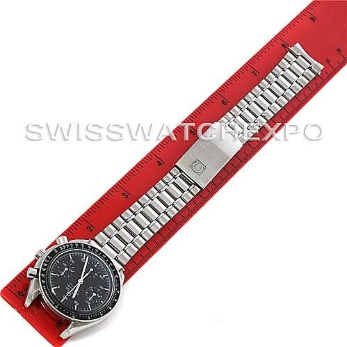 The Omega Speedmaster 3510.50.00 Men
s Stainless Steel Black Dial 3510.50.00 Men
s Stainless Steel Black Dial watch is shown laying flat with its face, bracelet, and clasp visible, next to a red ruler.