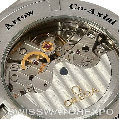 This image shows the intricate internal mechanism of an Omega Speedmaster 3581.30.00 Men's Stainless Steel White Dial 3581.30.00 Men's Stainless Steel White Dial watch at a close angle, highlighting the gears and cogs.