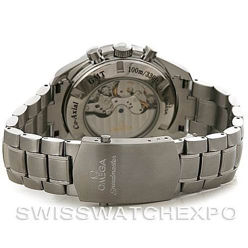 The image shows the back view of an Omega Speedmaster 3581.30.00 Men's Stainless Steel White Dial 3581.30.00 Men's Stainless Steel White Dial watch, featuring its stainless steel bracelet and transparent case back displaying the movement.