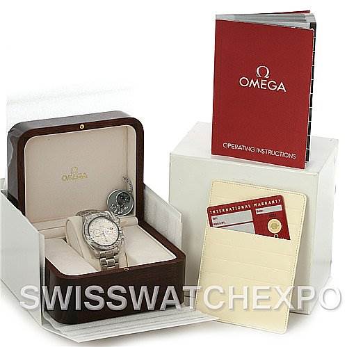 The image shows an Omega Speedmaster 3581.30.00 Men's Stainless Steel White Dial 3581.30.00 Men's Stainless Steel White Dial watch in its box, along with an operating instructions manual and an international warranty card.