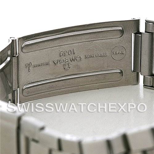 The image shows the clasp of an Omega Speedmaster Men
s Stainless Steel Black Dial Men
s Stainless Steel Black Dial watch bracelet, focusing on the inner engravings.