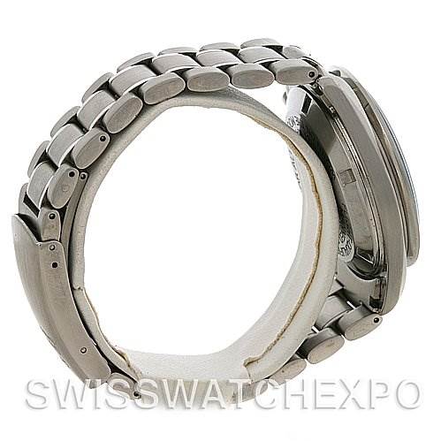 Side view of an Omega Speedmaster 3570.50 Men's Stainless Steel Black Dial 3570.50 Men's Stainless Steel Black Dial watch showing the bracelet and case profile on a cushion.