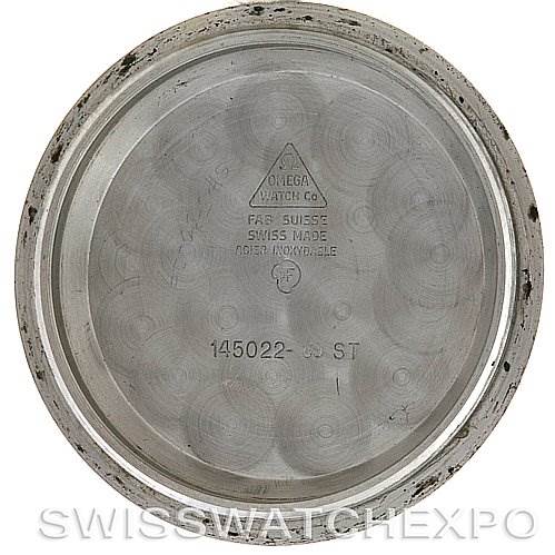 This image shows the inner case back of an Omega Speedmaster Men
s Stainless Steel Black Dial Men
s Stainless Steel Black Dial watch, with inscriptions visible, viewed from above.