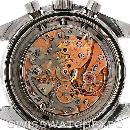 This image shows the intricate internal mechanics of an Omega Speedmaster Men
s Stainless Steel Black Dial Men
s Stainless Steel Black Dial watch from a rear, open-case angle.