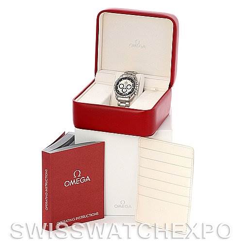 The image shows an Omega Speedmaster 3506.31 Men
s Stainless Steel Silver Dial 3506.31 Men
s Stainless Steel Silver Dial watch in its box, accompanied by operating instructions and a warranty or service card.