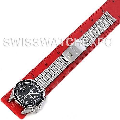 The Omega Speedmaster 3510.50 Men's Stainless Steel Black Dial 3510.50 Men's Stainless Steel Black Dial watch is shown from a top-down angle with the entire band laid out on a red ruler.