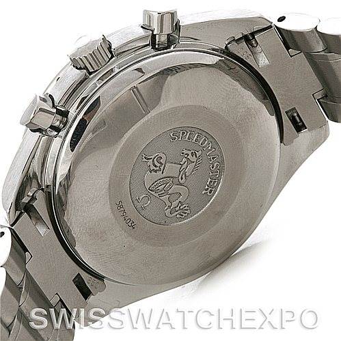 The image shows the back case, crown, and pushers of an Omega Speedmaster 3220.50.00 Men
s Stainless Steel Black Dial 3220.50.00 Men
s Stainless Steel Black Dial watch with a focus on the engraved case back.