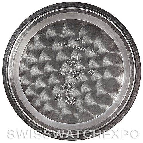 The image shows the inside of the case back of an Omega Speedmaster Men's Stainless Steel Black Dial Men's Stainless Steel Black Dial watch, displaying various model and manufacturing inscriptions.