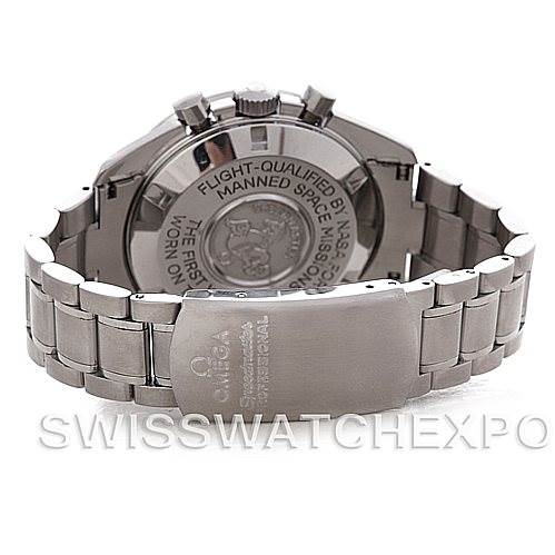 The image shows the back of the Omega Speedmaster Men's Stainless Steel Black Dial Men's Stainless Steel Black Dial watch, focusing on the case back and stainless steel bracelet.