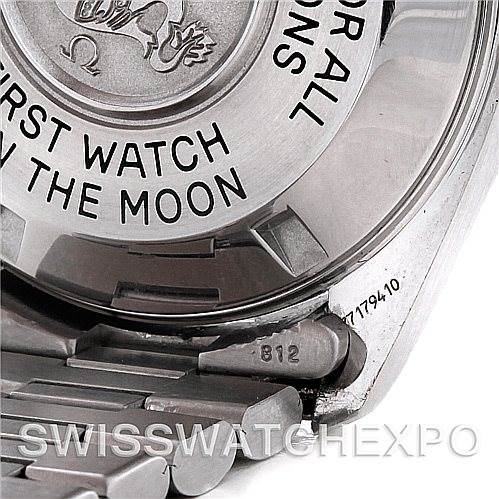 This is a close-up of an Omega Speedmaster 3570.50.00 Men
s Stainless Steel Black Dial 3570.50.00 Men
s Stainless Steel Black Dial watch showing the case back and a portion of the metal bracelet.