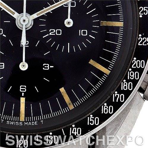 The image shows a close-up of the Omega Speedmaster 145.012 Men's Stainless Steel Black Dial 145.012 Men's Stainless Steel Black Dial's dial, highlighting the sub-dials, markers, and a portion of the bezel.