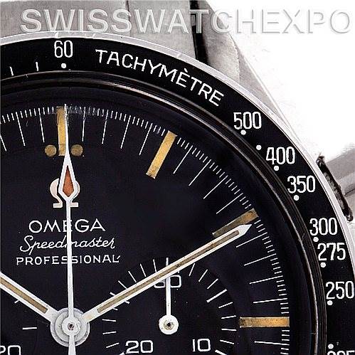 This close-up image shows part of the dial and Tachymètre bezel of the Omega Speedmaster 145.012 Men's Stainless Steel Black Dial 145.012 Men's Stainless Steel Black Dial Professional watch.