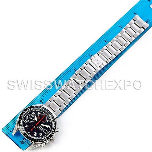 The Omega Speedmaster 3513.53.00 Men
s Stainless Steel Black Dial 3513.53.00 Men
s Stainless Steel Black Dial watch is shown from an overhead angle with its full metal bracelet displayed alongside a ruler for scale.