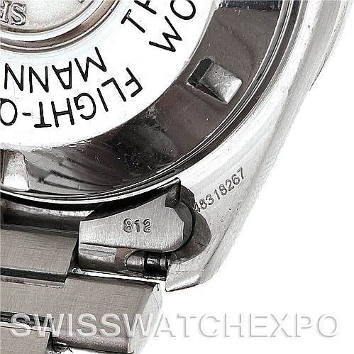 The image shows the backside and part of the bracelet of an Omega Speedmaster Men
s Stainless Steel Black Dial Men
s Stainless Steel Black Dial watch, focusing on the clasp and serial number.