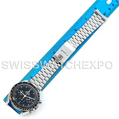 This image shows an Omega Speedmaster 3570.50.00 Men
s Stainless Steel Black Dial 3570.50.00 Men
s Stainless Steel Black Dial watch placed alongside a blue ruler, highlighting the watch face and metal bracelet.