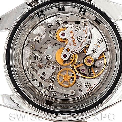 The image shows a close-up of the movement mechanism of an Omega Speedmaster 3570.50.00 Men
s Stainless Steel Black Dial 3570.50.00 Men
s Stainless Steel Black Dial watch, focusing on the intricate gears and components inside.