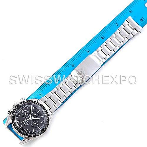 The image shows an Omega Speedmaster 3570.50.00 Men
s Stainless Steel Black Dial 3570.50.00 Men
s Stainless Steel Black Dial watch laid flat, right side up, alongside a ruler for measurement.