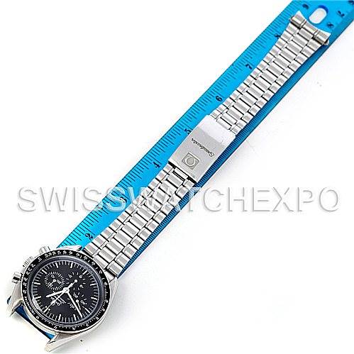 The image shows an Omega Speedmaster 3570.50.00 Men's Stainless Steel Black Dial 3570.50.00 Men's Stainless Steel Black Dial watch laid flat with a ruler measuring its length.